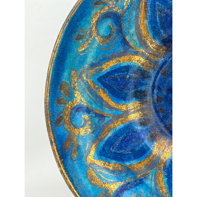 This striking hand-painted ceramic charger by Edith Cockcroft (1872–1962) is a stunning example of early 20th-century...