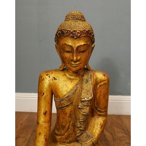 Impressive large carved Thai wooden figure of the Buddha depicted seated in meditation upon a richly decorated lotus base...