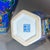 Striking matching pair of tall hexagonal Chinese famille rose porcelain vases with vibrant royal blue ground and raised...