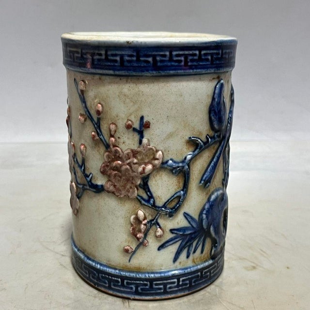 This exquisite ceramic vessel, traditionally used as a brush pot or scholar's desk accessory, features beautiful high-...