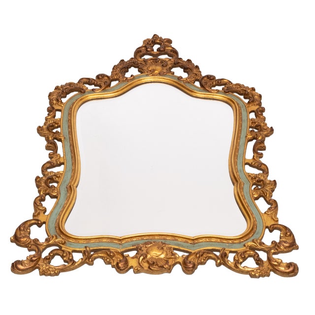An elegant Louis XV-style mirror, made in Belgium in the 1950s, This striking piece features an ornate gilded baroque...