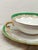 Twelve-piece Limoges porcelain tea set. Art Deco design by Georges Boyer, decorated with a green Empire border featuring...