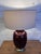 Design Plus Gallery presents a Vintage Ceramic Table Lamp. A deep bordeaux red glaze that brings richness and warmth to...