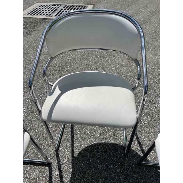 Handsome vintage modern Steelcase chrome tube cantilever base original white faux leather or vinyl seats and rounded...