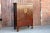 Chinoserie armoire with a simple but elegant design of two doors that open to two storage shelves. This cabinet features a...