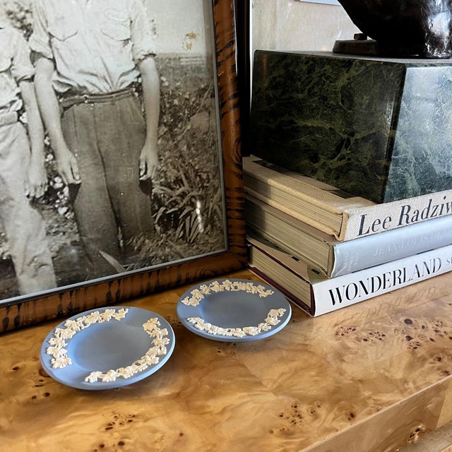 This elegant Wedgwood blue jasperware ashtray is a refined example of mid-century English neoclassical design. Crafted in...