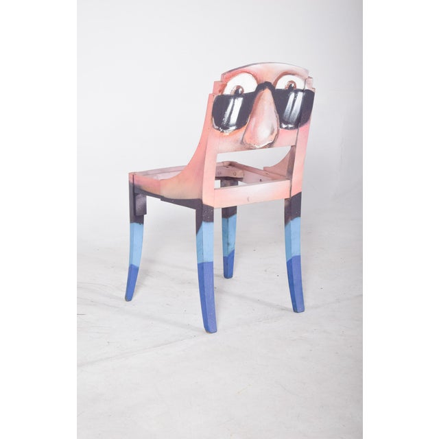 Painted dining chair. Reinterpreted with contemporary artistic intervention, transforming a functional object into a piece...