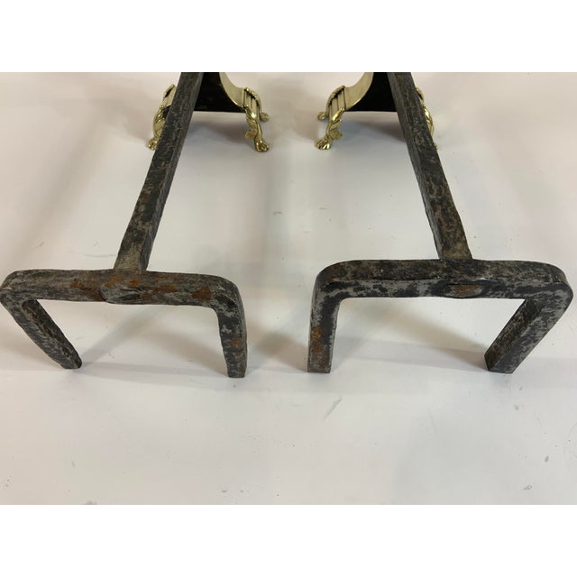 Pair of vintage classic English brass andirons with claw feet. Finial design with hammered iron log rest. Heavy-weight...