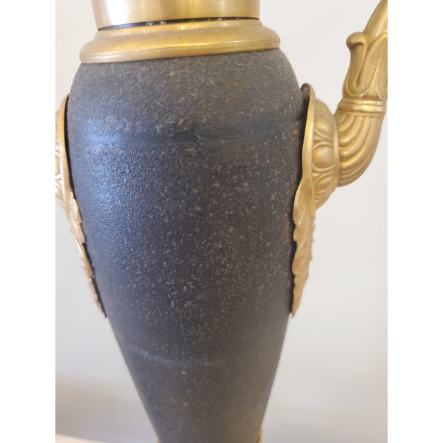 Empire style antique brass lamps.