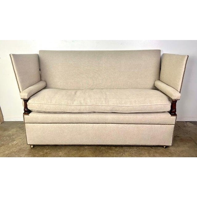 This is an early 20th century interpretation of the infamous, upholstered 17th century couch with hinged arm rests, found...