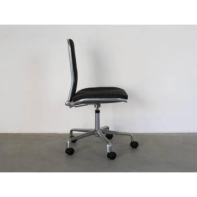 Desk chair polished aluminum, seatheight adjustable 46cm/56cm, back adjustable. This piece has an attribution mark, I am...