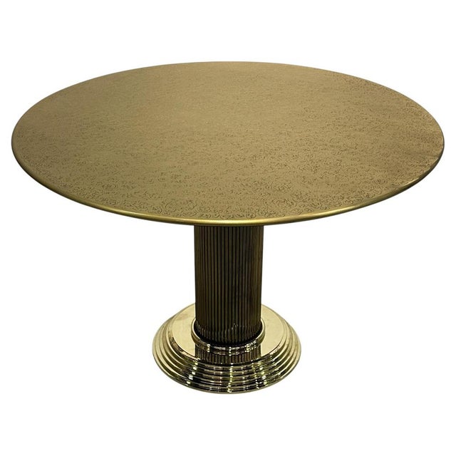 A striking round dining table from 1970s Europe, defined by its strong decorative presence and refined sculptural...
