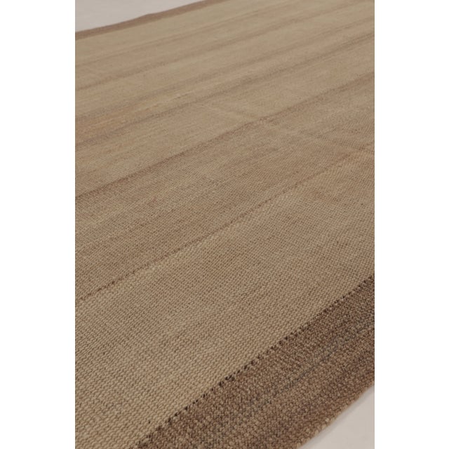 Handwoven in wool, this 5x7 contemporary kilim is a sophisticated addition to Rug & Kilim’s curation. This brand-new piece...