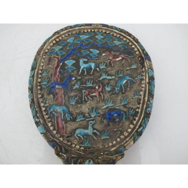 Incredibly beautiful antique Chinese hand mirror. Silver metal with elaborate woodland creature design, painted in...