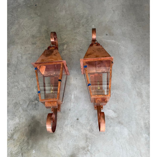 A matched pair of hand-built copper gas lanterns by Charleston Lighting & Manufacturing of Mobile, Alabama, a coppersmith...