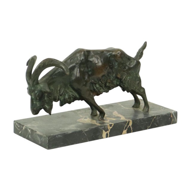 Beautiful antique solid bronze statue of a goat or ram mounted on a rectangular marble base. This animal sculpture is in...