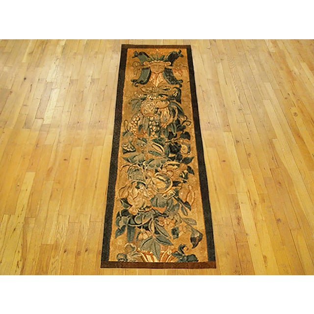 A 16th century Brussels Historical Tapestry panel. This vertically oriented decorative tapestry panel depicts a scrolling...