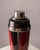 An elegant Art Deco cocktail shaker, made around 1940 and designed in the decorative style associated with Jean Dunand and...