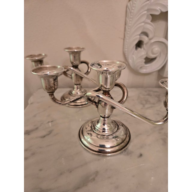 Pair of wighted EL-SIL-CO sterling three arm candelabra. Vintage (typically 1930s-1950s) weighted sterling silver candle...