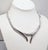 1970s rhodium-plated articulated tubular with twisted and smooth sections with two downward spikes in the center necklace...