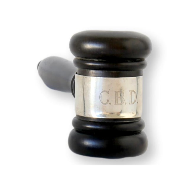 Antique English ebony ceremonial gavel, a symbol of authority and tradition. This handcrafted piece, adorned with the...