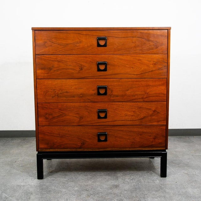 Handsome 5 drawer highboy dresser in walnut. Sculpted metal rounded handled within each drawer. Signed within the top...