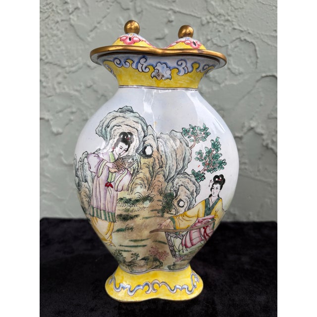 This elegant vintage decorative vase features a richly detailed hand-painted scenic motif inspired by traditional Chinese...