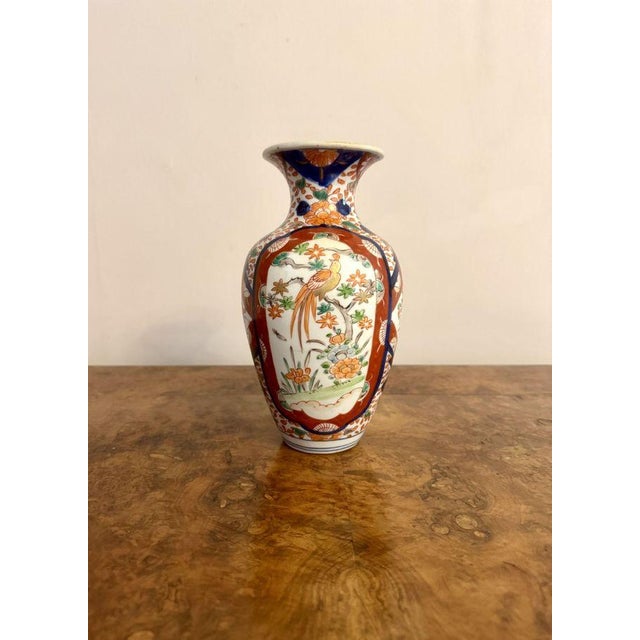 Quality antique Japanese imari vase, having a quality antique Japanese imari vase with a bulbous shaped body with a fluted...