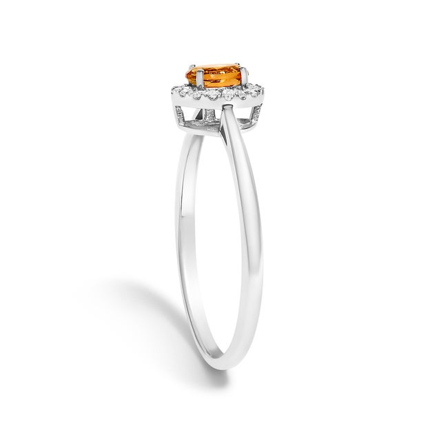 Early 21st Century 10K White Gold 5X3MM Oval Orange Citrine and Diamond Accent Halo Ring (I-J Color, I1-I2 Clarity) - Ring Size 7 For Sale - Image 5 of 7