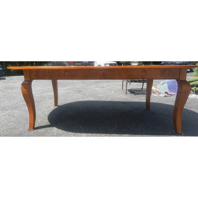 Gorgeous, heirloom quality solid maple dining table custom built by the highly sought-after local artisan workshop,...