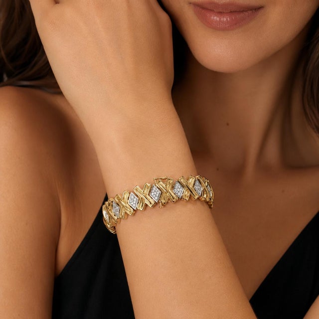 14k Yellow Gold Bracelet with 117 white diamonds weighing approximately 2.00 carats. 29.87g. Length: 7.0 in.