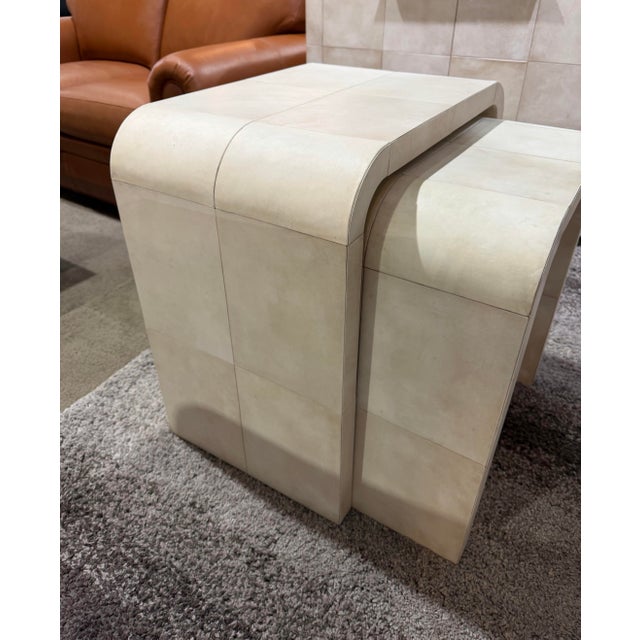 A study in refined utility and timeless sophistication, this pair of Restoration Hardware Parchment Leather Nesting Tables...