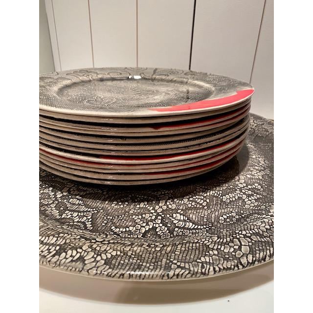 A small potter studio in South Africa produces these hand-made platters and dinner plates. The face of the plates and...