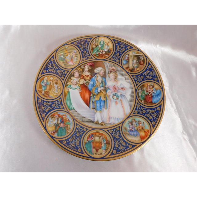 This is a plate marked Porcelaine Franklin and marked/signed in a name I cannot read. It also has some markings that seems...