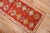 An early 20th century narrow and short antique oushak runner in red. Measures: 2'5'' x 6'6''.