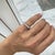 Gender: Ladies Metal Type: 14K White Gold Ring Size: 4 Width: 3.50 mm Weight: 3.80 grams Lady's rhodium-plated 14K white...