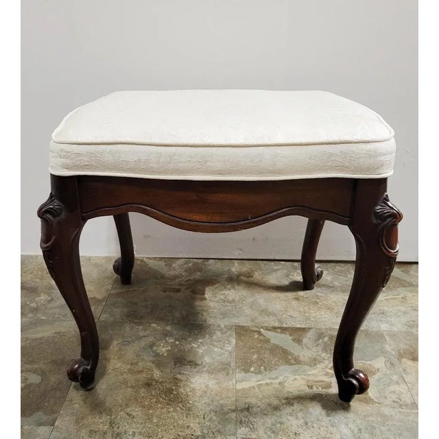 This elegant 1945–1955 American footstool was crafted by Sanford Furniture Company of North Carolina and reflects a...
