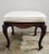 This elegant 1945–1955 American footstool was crafted by Sanford Furniture Company of North Carolina and reflects a...
