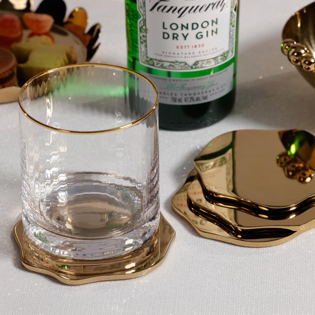 Elevate everyday entertaining with this set of polished metal beverage coasters, designed to offer both function and...