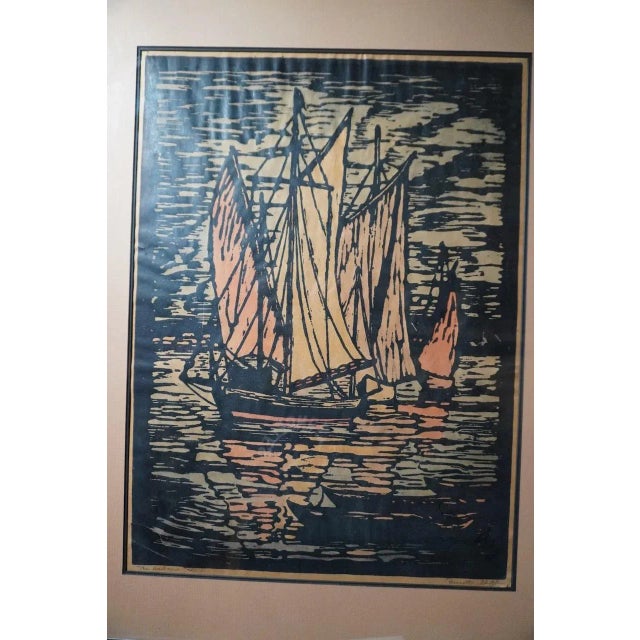 Beautiful hand-tinted block print titled The Harbor by artist Prescott Chaplin, circa 1920s. The piece features intricate...