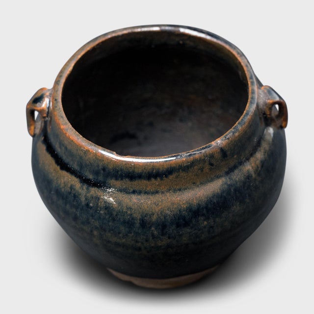 This petite glazed jar from China's Shanxi province exemplifies the timeless appeal of handcrafted pottery. Once used in...