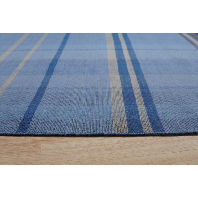 Maya Opulent Blue Flatweave Wool Rug, Country of Origin: India. This exceptional flatweave piece showcases the...