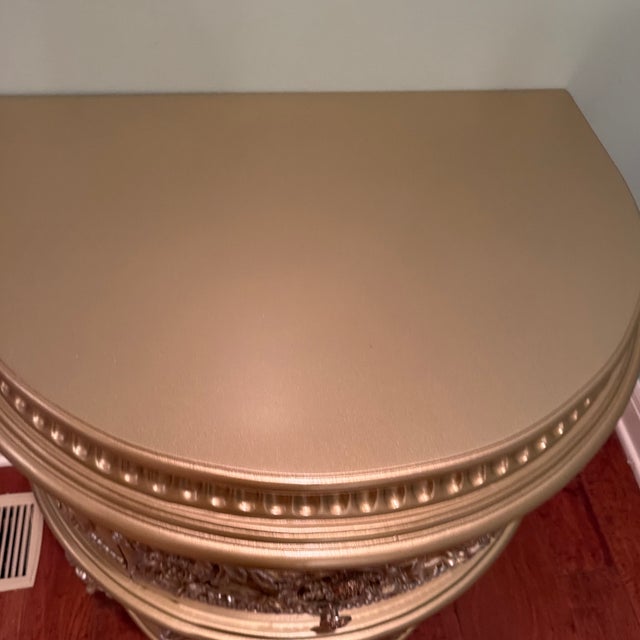 An exquisite statement piece featuring an opulent antique champagne-gold finish and beautifully detailed European-inspired...