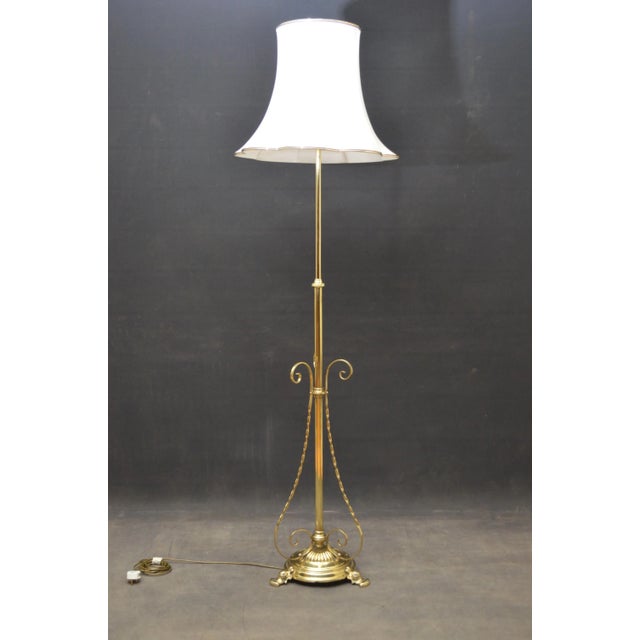Stylish Arts and Crafts height adjustable standard lamp on fluted circular base, decorative twisted supports and pad feet....
