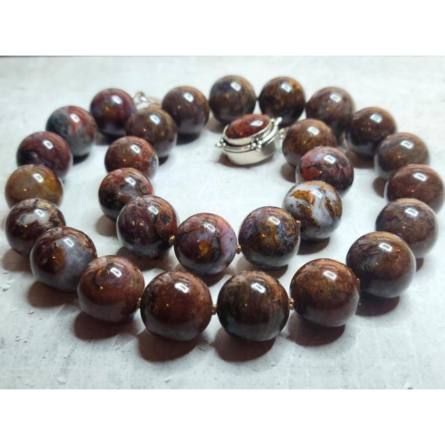 This exquisite necklace is made of natural pietersite, a gemstone known for its deep energy and unique color play. The...