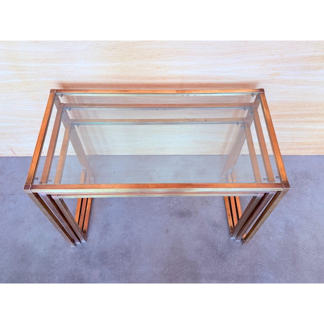 Set of Three Italians nesting tables, brass in original patina and glasses in perfect conditions,. Measures: Large W...