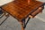 This Georgian Style Parquetry Top Coffee Table with Scalloped Edge and X-Form Stretcher from the late 21st Century is a...