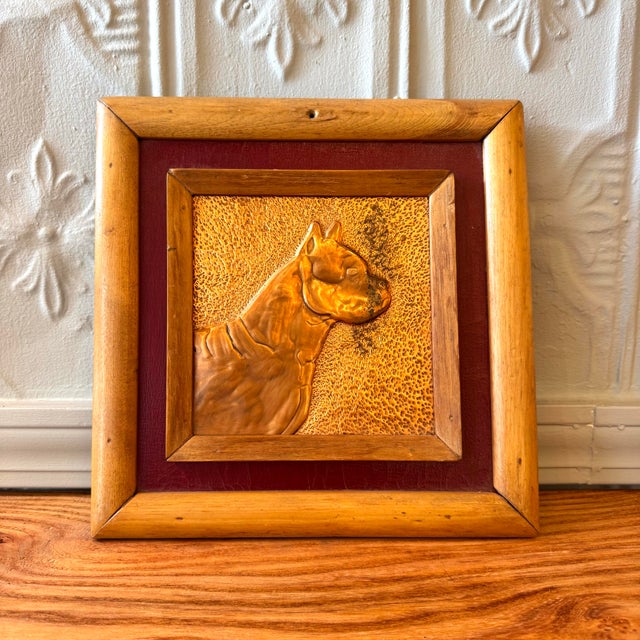 Hand-hammered repoussé copper dog portrait mounted on a textured copper field, set within a rustic wood inner frame and...