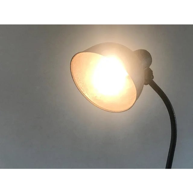 An early version of model 6551 with a smaller shade. The lamp is beautifully weathered with a deep, all over patina that...