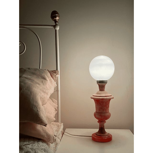 Beautiful vintage table lamp base hand carved in Italy, in the 1960s-70s from solid pink alabaster, featuring elegant...